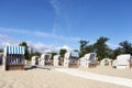 Wicker beach chairs on empty sandy beach Royalty Free Stock Photo
