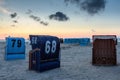 Beach chairs on the North Sea at dusk, Neuharlingersiel, East Frisia, Germany