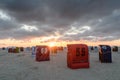 Beach chairs on the North Sea at sunset, Neuharlingersiel, East Frisia, Germany