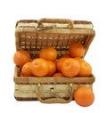 Wicker box filled with tangerines over white Royalty Free Stock Photo