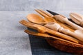 Set of wooden kitchen appliances, spoons, scoops, forks and knives. View from above. Royalty Free Stock Photo