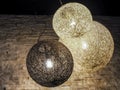 Wicker cane electric globe lighting hanging from the ceiling Royalty Free Stock Photo