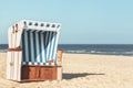 Wicker chair at the beach on Sylt island. Sunny beach day Royalty Free Stock Photo