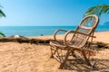 Wicker chair on the sandy beach Royalty Free Stock Photo