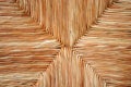 Wicker chair, straw background Royalty Free Stock Photo