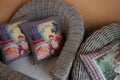 Wicker chairs, cushions with Christmas pictures