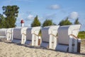 Wicker chairs on an empty beach Royalty Free Stock Photo