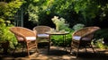 Wicker chairs and a metal table in an outdoor summer garden Royalty Free Stock Photo