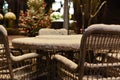 Wicker chairs and street cafe table on christmas night Royalty Free Stock Photo