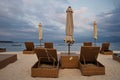 Wicker chairs and table on a beach Royalty Free Stock Photo