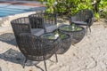 Wicker chairs and table in empty beach cafe next to sea. Close up. Thailand Royalty Free Stock Photo