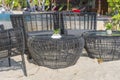 Wicker chairs and table in empty beach cafe next to sea. Close up. Thailand Royalty Free Stock Photo