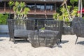 Wicker chairs and table in empty beach cafe next to sea. Close up. Thailand Royalty Free Stock Photo