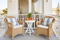wicker chairs and table set on the balcony of a mediterraneanstyle house Royalty Free Stock Photo