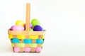 Wicker Easter basket filled with colorful eggs