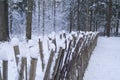 Wicker fence covered with snow Royalty Free Stock Photo