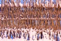 Wicker fence covered with snow texture. Rural area Royalty Free Stock Photo