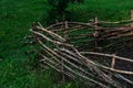 Wicker fence. Decorative fence of branches design of the garden