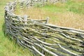 Wicker fence made from laced young twigs