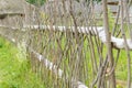 Wicker fence made of natural branches, beackground, texture Royalty Free Stock Photo