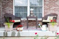 Wicker furniture on the patio with a samovar