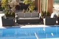 Wicker furniture sets by the pool Royalty Free Stock Photo