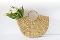 Wicker Handbag with Flowers Tulips, Spring Time, Summer Concept Royalty Free Stock Photo