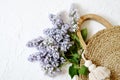Wicker Handbag with Lilac Flowers , Spring Time, Summer Concept Royalty Free Stock Photo