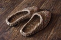 Wicker home low slippers, bast shoes or Lapti woven from wood bast. A modern version of old traditions
