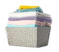 Wicker laundry basket with clean towels on white Royalty Free Stock Photo