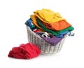 Wicker laundry basket with different clothes isolated Royalty Free Stock Photo