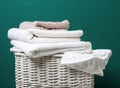 Wicker laundry basket with dirty clothes and clean towels Royalty Free Stock Photo