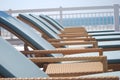 Wicker lounge chairs poolside by the beach Royalty Free Stock Photo