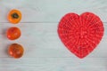 Wicker paper tube red heart on white wood boards, love and wedding concept, Valentine`s day, background Royalty Free Stock Photo