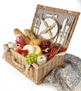 Wicker picnic hamper with assorted fresh food Royalty Free Stock Photo