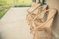 Wicker rattan chair on balcony terrace patio near garden Royalty Free Stock Photo