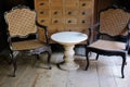 Wicker rattan chair & old vintage drawer cabinet in living room