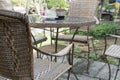 wicker rattan chair and table on patio in garden Royalty Free Stock Photo