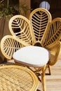 Wicker rattan chairs on floating bar counter with garden outside. Summer resort cafe . Trendy outdoor design. Royalty Free Stock Photo