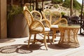 Wicker rattan chairs on floating bar counter with garden outside. Summer resort cafe . Trendy outdoor design. Royalty Free Stock Photo
