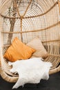 Wicker rattan hanging chair in cafe. Eco friendly furniture style and concept Royalty Free Stock Photo