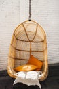 Wicker rattan hanging chair in loft hipster cafe Royalty Free Stock Photo