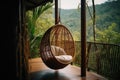 Wicker rattan hanging chair on wooden bamboo terrace in the jungle. Generative AI Royalty Free Stock Photo