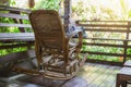 Wicker rocking chair on a wooden house Royalty Free Stock Photo
