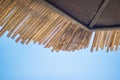 Wicker roof beach umbrella and blue sky Royalty Free Stock Photo