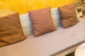 wicker sofa with brown cushion and pillow