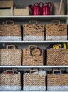 Wicker storage box on shelves
