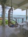 Wicker swing chair on porch