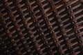 Wicker texture in dark brown tones. Bound stripes made of artificial plastic material