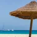 Wicker umbrella and blue ocean